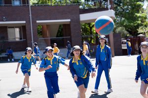 St Therese Catholic Primary School Lakemba - students playing basketball at school yard